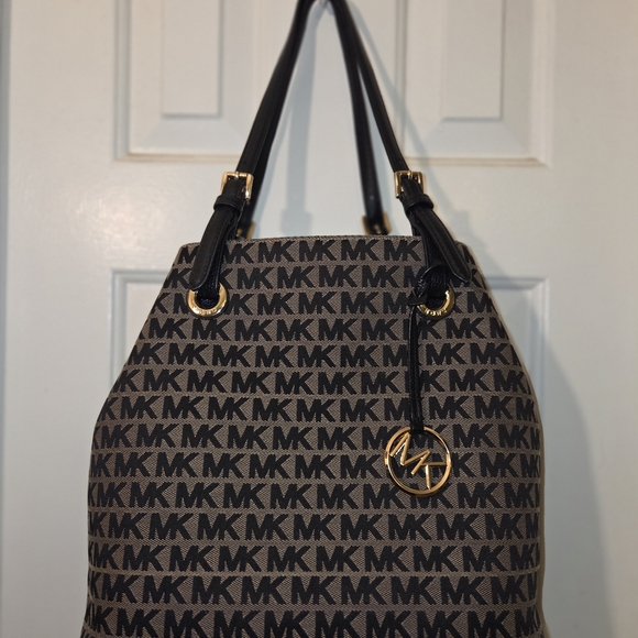 Michael Kors: Gently Used Condition Signature Black and Tan Tote. - Picture 12 of 16